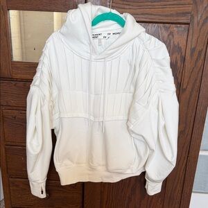 FP movement white hoodie with thumb holes and kangaroo pocket